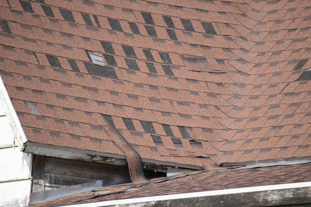 damaged asphalt shingle roofing due to strong wind San Marcos, CA